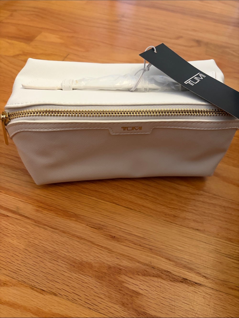 Tumi White Cosmetic Pouch with Gold-Zip Accent
